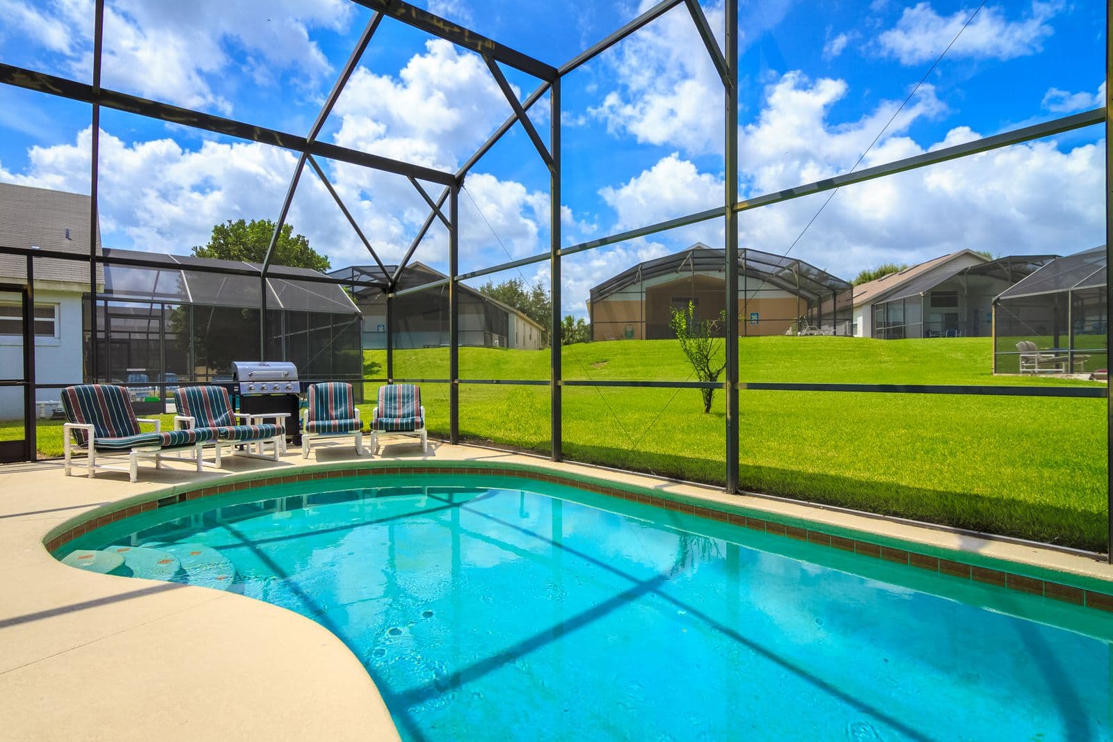 Screened pool enclosure over a clean Florida lanai